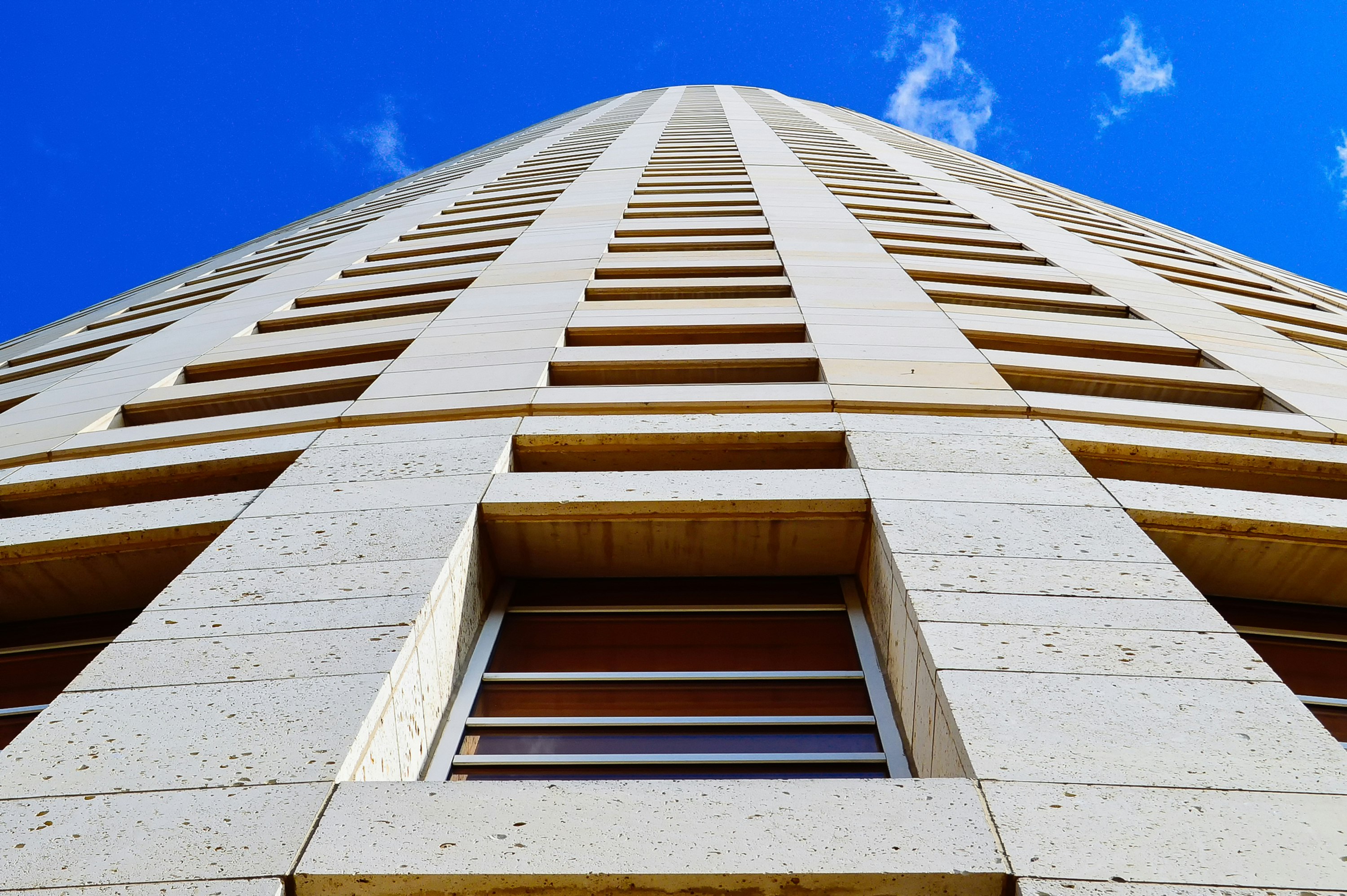 white concrete building under blue sky during daytime